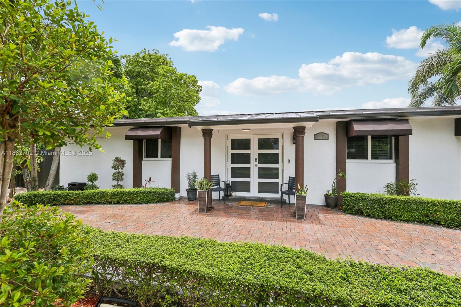 This charming 3/2 corner home features an open concept living area filled with natural light, an updated kitchen with quartz countertops, and a spacious master suite. Home has been landscaped throughout including a covered patio and cooking area perfect to host all your friends and family. Home is in close proximity to top rated schools, major highways, shopping and dining. All updates within the last 2 years - included is impact windows and doors, PVC plumbing, new roof, driveway, PVC plantation shutters, Camera system, and recently tented.