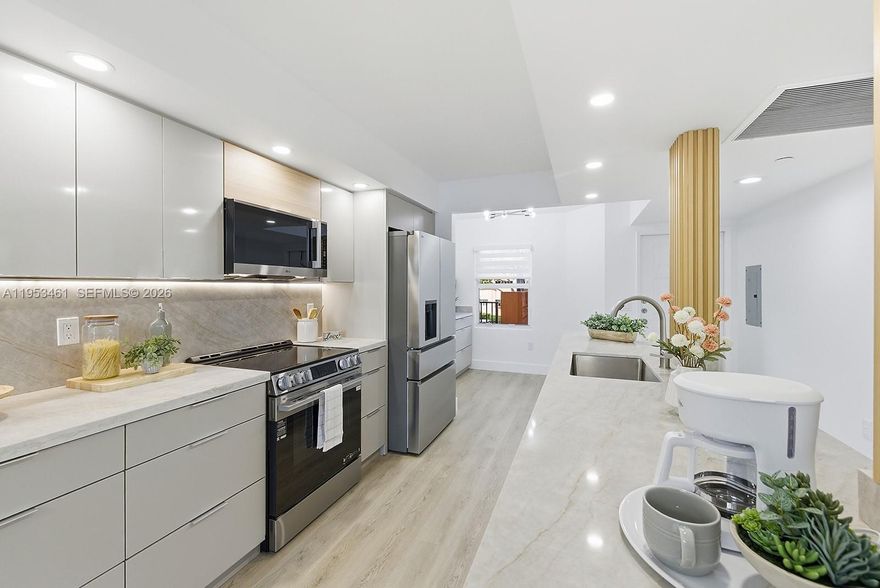 Beautiful Lake Views!! Charming fully remodeled condo in Century Village offering tranquil lake views from the living areas. This residence features a contemporary modern kitchen with ceiling-height custom cabinetry, brand-new tankless water heater premium vinyl flooring, fresh designer paint, and LED lighting throughout. Both bathrooms have been tastefully modernized. Accordion shutters included. Located in an exclusive 55+ community with resort-style amenities including a golf course, swimming pools, fitness centers, and an active clubhouse. Ideally situated near upscale shopping, dining, and entertainment. HOA $778. Inlcudes water, cable, internet, master insurance, club house and much more!