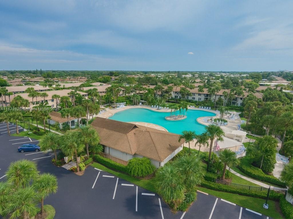 Welcome to Winterpark in Naples, a highly sought-after community just minutes from downtown and the Gulf of Mexico. The primary suite features a walk-in closet and private bath with walk-in shower, while the guest bedroom and second full bath. The kitchen includes modern appliances, a breakfast bar, and plenty of storage, opening seamlessly to the dining and living areas with sliding doors to a private patio. In-unit laundry, assigned parking, and concrete block construction. Winterpark is known for its resort-style amenities including one of the largest community pools in Naples, tennis courts, and a clubhouse, all surrounded by lush landscaping. With low-maintenance living, affordable association fees, and a prime location near shopping, dining, golf, and Naples’ beautiful beaches.