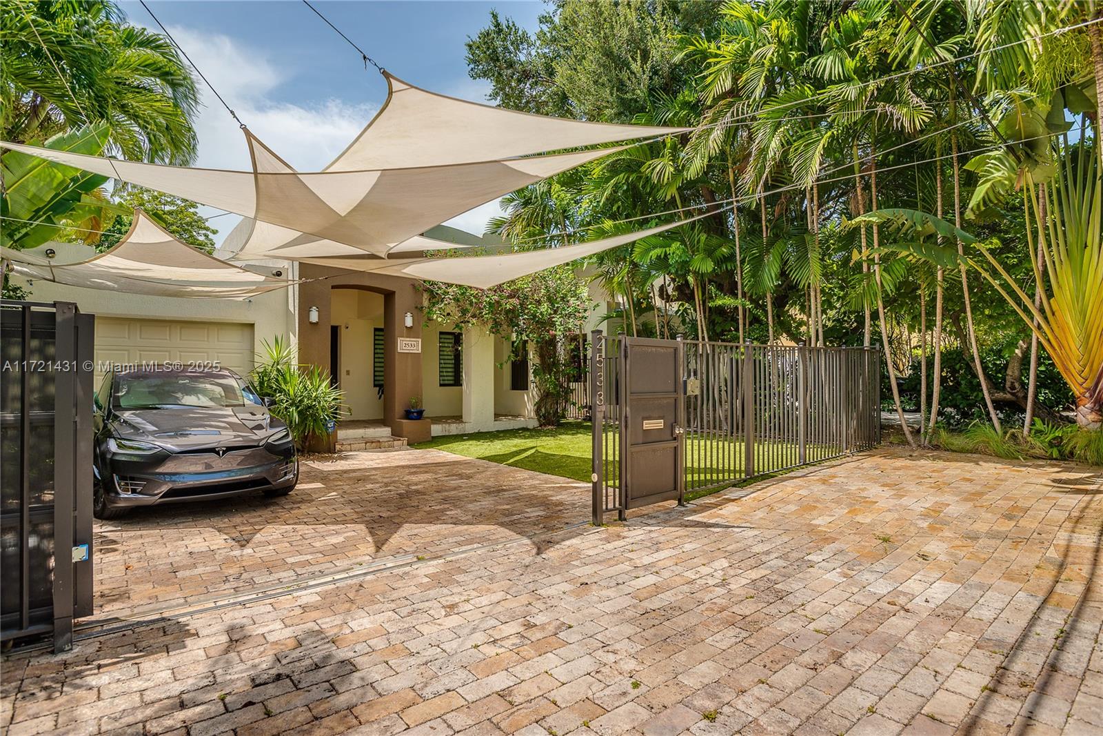 Private and secluded oasis in the heart of Coconut Grove. Open floor design: inviting ambiance and a practical professional chef's kitchen with gas stove for those who love to cook and entertain; large living room and wine cellar. Sono's stereo system throughout the house and patio with independent zones for comfort. Beautifully landscaped garden with lush vegetation, a pond with Koi fish, an intimate patio with plenty of seating for entertainment, pool table and a commercial gas BBQ. Gated parking for two vehicles plus an additional eight parking spaces in the back. The home also has 2 private entrances. Gas generator for entire house. Additional storage in the building as well. Easy access to US1, walking distance to Metro Station, minutes from downtown and CocoWalk