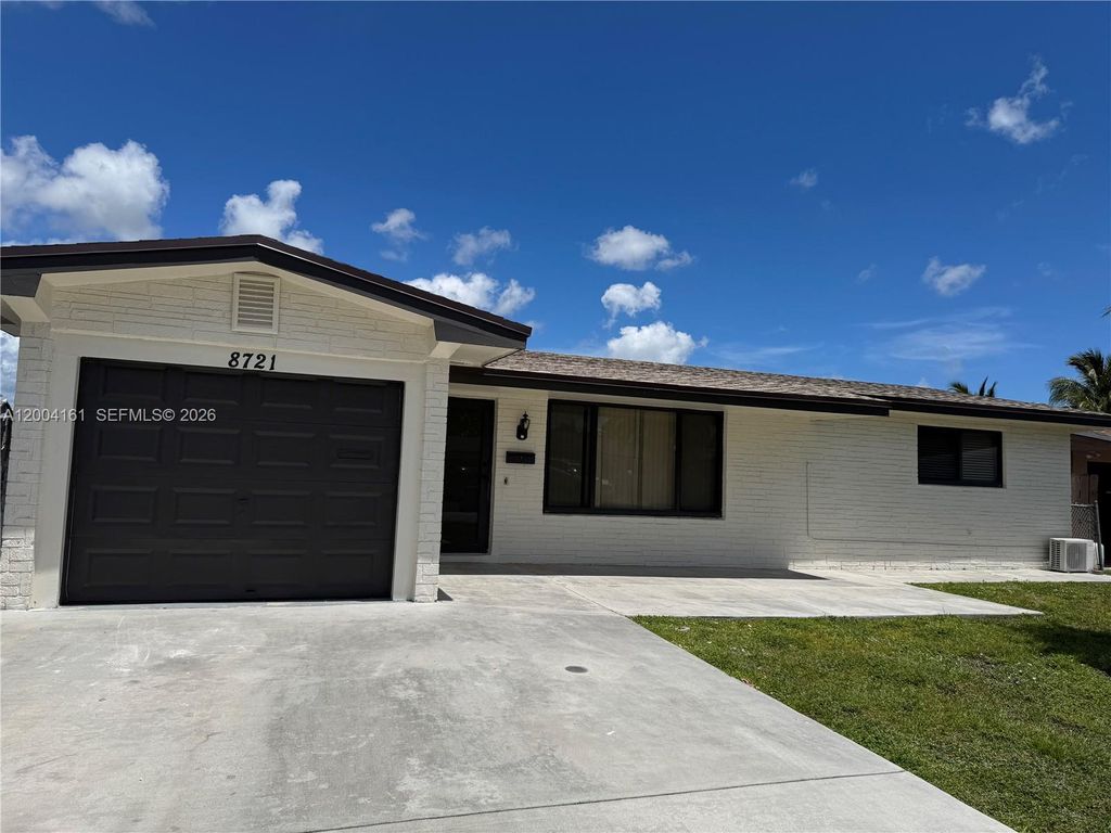 Photo of 8721 NW 11th St, Pembroke Pines, FL 33024 (MLS # A12004161)