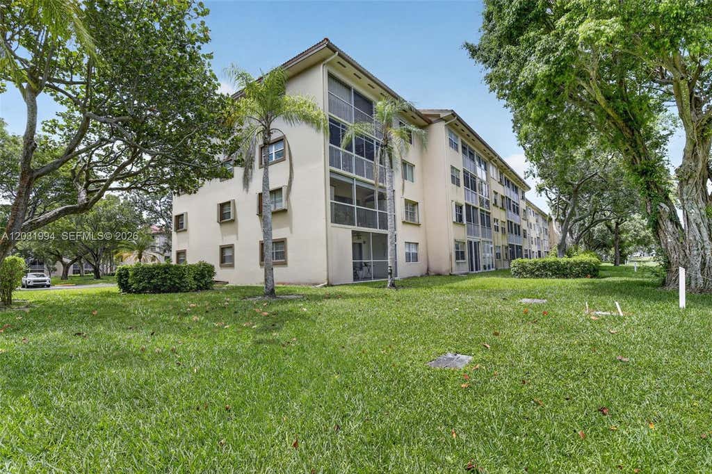 Photo of 1200 SW 125th Ave #410L, Pembroke Pines, FL 33027 (MLS # A12031994)