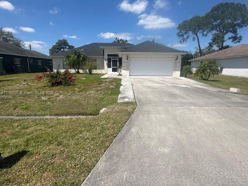 Photo of 332 NW Hibiscus St, Port Saint Lucie, FL 34983 (MLS # A11784707)