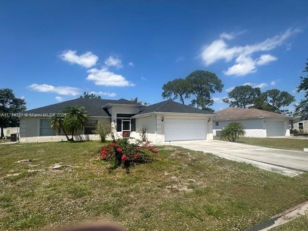 Photo of 332 NW Hibiscus St, Port Saint Lucie, FL 34983 (MLS # A11784707)