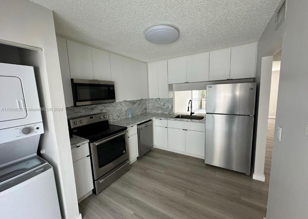 Photo of 3000 NW 5th Ter #113, Pompano Beach, FL 33064 (MLS # A11559890)