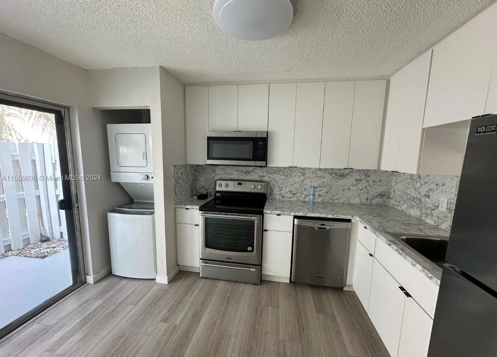 Photo of 3000 NW 5th Ter #113, Pompano Beach, FL 33064 (MLS # A11559890)