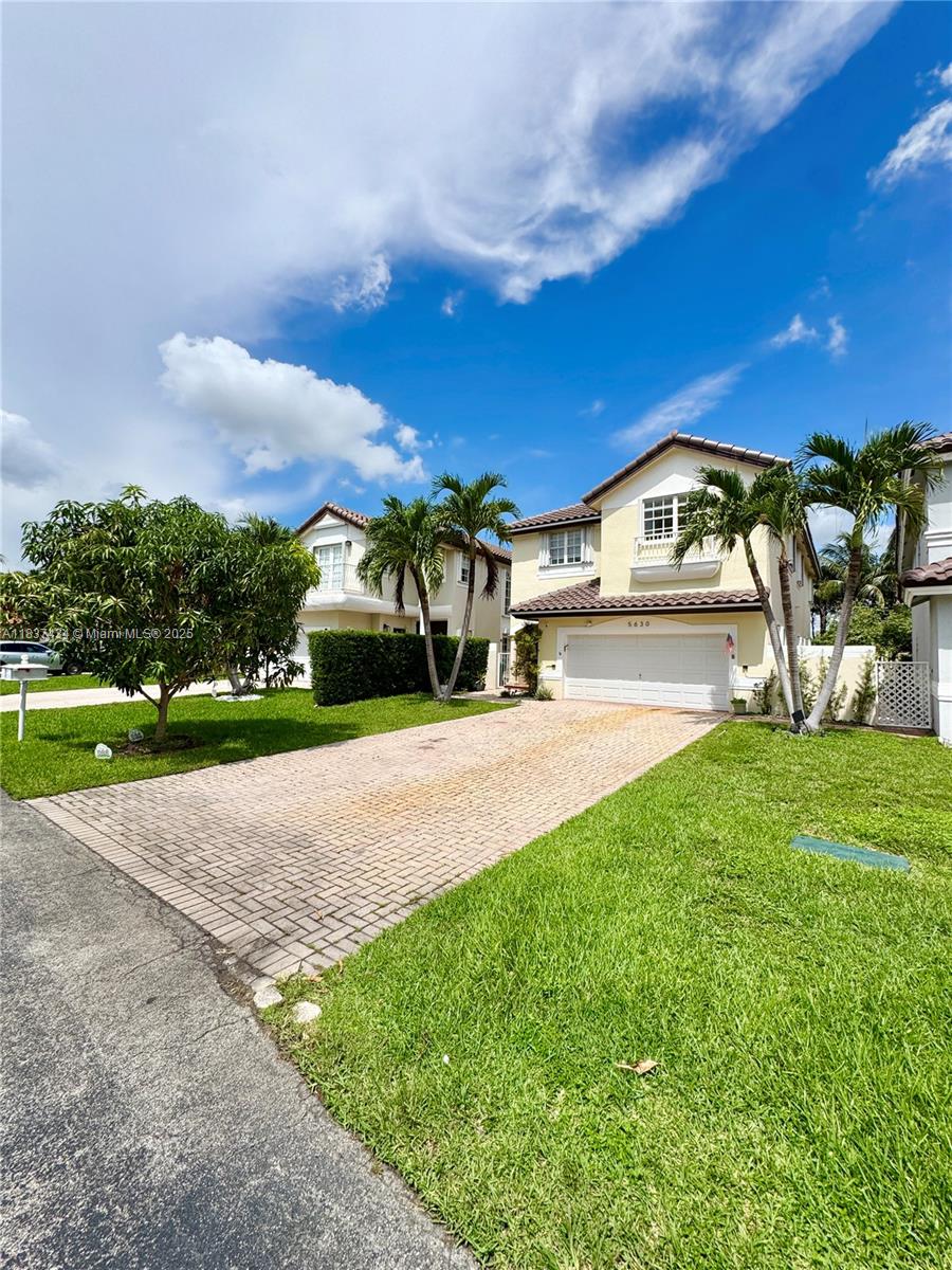 This lakefront gem is nestled right on the green, in the prestigious gated community of Doral Palms, perfectly positioned with private access to the golf course with views of the fairways and lake! Inside you will find the open floor plan with modern finishes thru-out. Spacious living areas feature porcelain flooring, sky high ceilings & natural lighting that floods the entire home. The gourmet kitchen is complete with quartz countertops & stainless steel appliances ideal for everyday living. The master suite offers peaceful retreats with a private balcony overlooking the lush greens & lakefront. Residents of this community enjoy exclusive access to a well-appointed clubhouse with gym.Walk your kids to school via the golf course to the A+ school (grades K-8). Schedule your showing today!