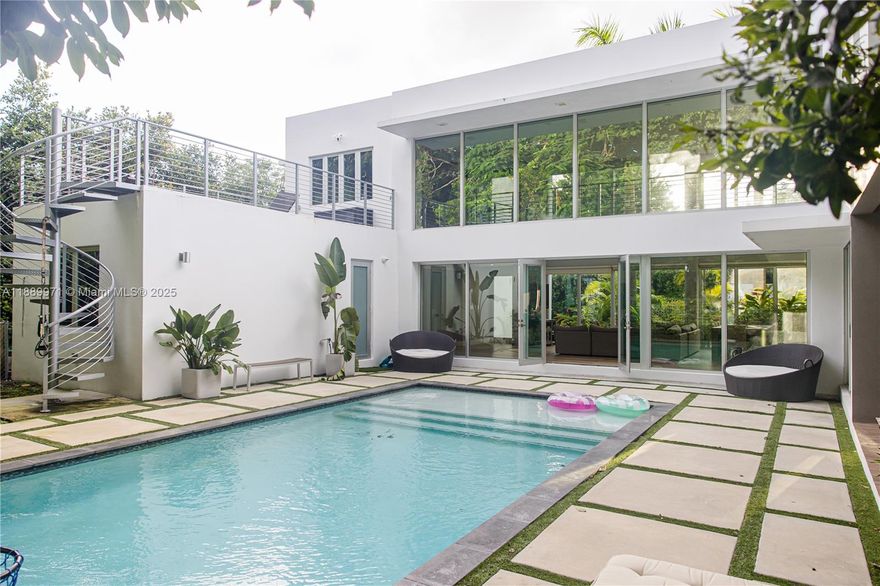 Come fall in love with this Modern Masterpiece. Featuring a spacious property, nestled in a lush tropical setting, offering an open floor plan which seamlessly blends indoor & outdoor living with tons of natural light; 4 bedrooms/3.5 baths plus 2 dens/media rooms, 2 car garage, beautifully landscaped garden, private pool, & contemporary design. Roof top sun deck overlooking pool/garden view. Residents enjoy a tranquil atmosphere w/ easy access to shopping, dining, & entertainment options in South Miami. The area is also known for its excellent schools, proximity to parks and recreational facilities, making it an ideal location for families seeking both luxury & convenience. This exceptional property offers too many luxuries to list, truly one of a kind. Available short & long term.