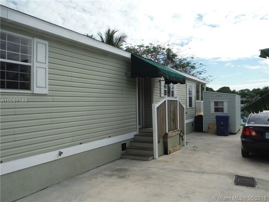 Beautiful Lakefront Double-Wide Modular Home in a great Park in Florida City w/easy access to the Turnpike & minuets from Key Largo. Own this well-kept 2 beds/2 baths home, could be converted to a 3/2 & family room. This unit has a large kitchen w/all appliances, breakfast area & family room. Comes w/large laundry room w/washer & dryer hookups, utility shed outside & large concrete driveway, brand new central a/c unit! Enjoy a beautiful view of the lake. Great starter home or investment opportunity!!