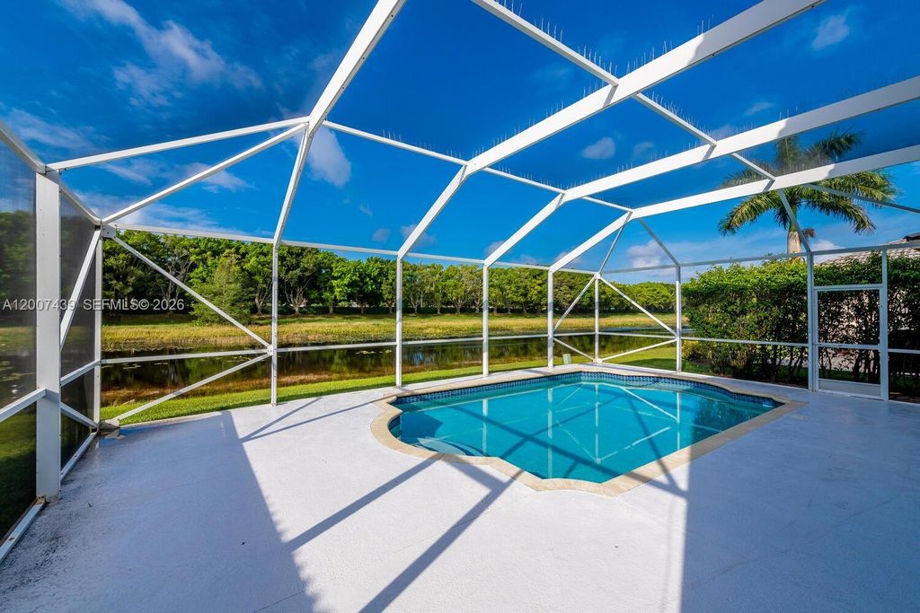 Photo of 801 Tanglewood Cir, Weston, FL 33327 (MLS # A12007439)