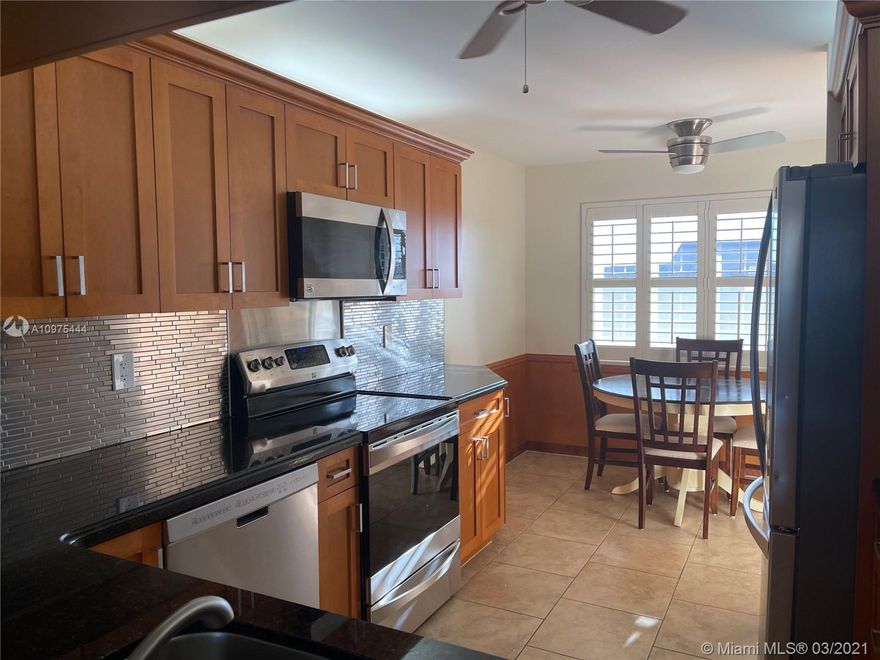 Amazing community with lots of amenities, Fabulous updated apartments with lots of perks, Custom kitchen with maple wood soft close cabinets, lots of cabinet space, granite counter tops,3yrs old, tops of the line stainless steel Kenmore Elite appliances,Stainless steel back splash, Bahama shutters in eat in kitchen, Both full bathrooms updated with frameless door frames , wood cabinets , with great linen closets and lots of storage space. Tankless Water heater is 3 yrs old,AC unit includes ultraviolet light and easy access to ac filter. Super large capacity whirlpool washer and dryer, all closets custom made. Security system thru out, No popcorn ceilings, recently updated inside and outside move in ready , a must see! Accordion shutters ...Beautiful elegant Chandelier(dining room)