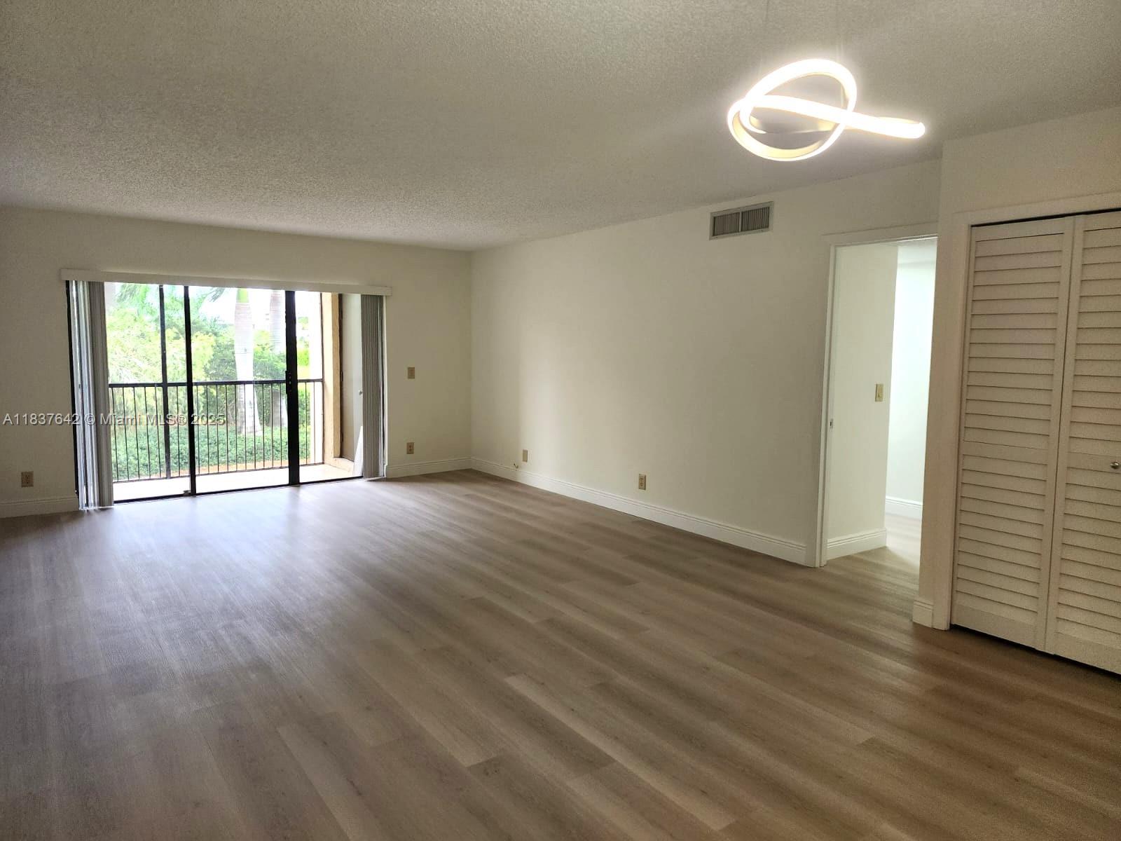 Beautifully updated apartment, Freshly painted, the home features brand-new laminate flooring elegant bathrooms. 2 spacious bedrooms and 2 bathrooms, big closets, this home is designed for both comfort and style. Big screen balcony provides additional living space. Serene view to the garden and indirect lake, creating a stunning for relaxation. Offer a storage and 1 parking, while the Bonaventure clubhouse boasts a large gym and a variety of top-tier amenities. The best schools in the area. The association fee included: Water service, waste, maintenance of common areas, roof care, Lanscaping & Pool. Additional enjoy the Bonaventure club