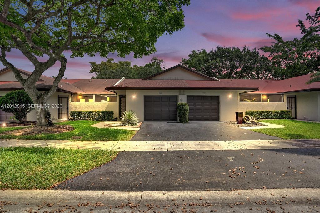 Photo of 9011 NW 61st St, Tamarac, FL 33321 (MLS # A12018815)