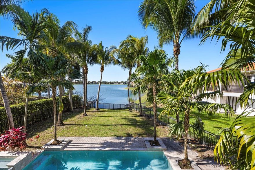Exceptional lakefront living defines this elegant 5-bedroom, 4.5-bath pool home, nestled within the prestigious guard-gated community of Cutler Cay. Located on a quiet cul-de-sac and set on an expansive 12,561-square-foot lot, the residence offers breathtaking lake views, soaring ceilings, and a seamless open-concept layout ideal for both everyday living and entertaining.

The spacious kitchen is equipped with upgraded appliances and flows effortlessly into both formal and casual dining areas. A thoughtfully designed floor plan includes a private in-law suite with its own full bath, perfect for extended family or guests. The primary suite serves as a tranquil retreat, featuring a generous bathroom and abundant closet space.

Step outside to your own tropical oasis, complete with a resort-style pool, mature palm trees, and lush privacy hedges overlooking the water. Additional highlights include solar panels, a two-car garage, and a deep driveway providing ample parking.

Residents of Cutler Cay enjoy access to world-class amenities, including a grand clubhouse, resort-style pool, state-of-the-art fitness center, tennis courts and a playground, —all set within a beautifully landscaped waterfront community.

Ideally located just off historic Old Cutler Road, this home offers convenient access to Coral Gables, Pinecrest, top-rated schools, premier shopping, and dining.