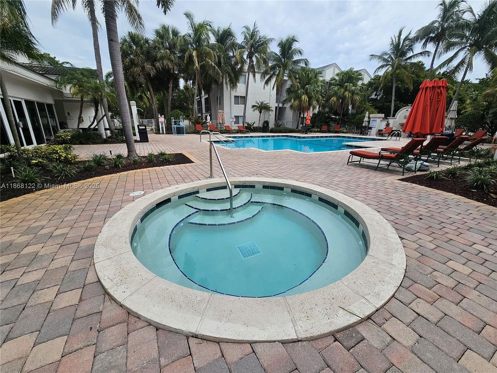 Photo of 5686 Rock Island Rd #136, Tamarac, FL 33319 (MLS # A11868122)