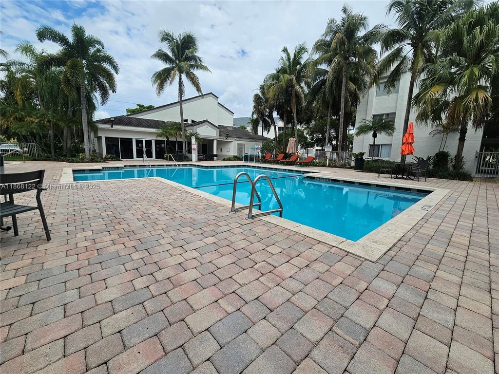 Photo of 5686 Rock Island Rd #136, Tamarac, FL 33319 (MLS # A11868122)