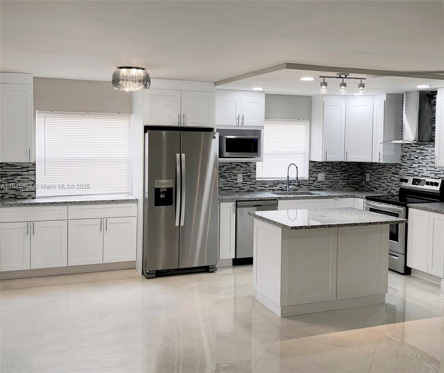 Must see! BEAUTIFULLY RENOVATED 1st Floor 2B/2B condo with garden view in Kings Point & Country Club 55+ gated community. New wood cabinetry in kitchen & baths, new baseboards, granite countertops, new stainless-steel appliances, energy-efficient LED lighting across an open floor plan. Notable features include an extended over-sized open kitchen (one of largest in Kings Point) & 32 x 32 diagonal flooring throughout. Stunning bathroom designs include ultra-contemporary touch to activate lighting built-in to vanity mirrors. Includes ceiling fans throughout, window treatments, built-in floor to ceiling dressing mirror & a remote-controlled electric decorative fireplace. Enclosed patio with A/C, washer & dryer. Pool, 3 multi-million dollar clubhouses 2 Executive Golf Courses & more