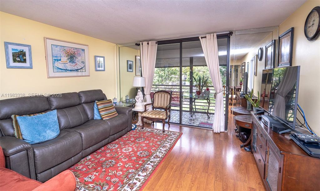 Photo of 1000 Colony Point Cir #203, Pembroke Pines, FL 33026 (MLS # A11983338)