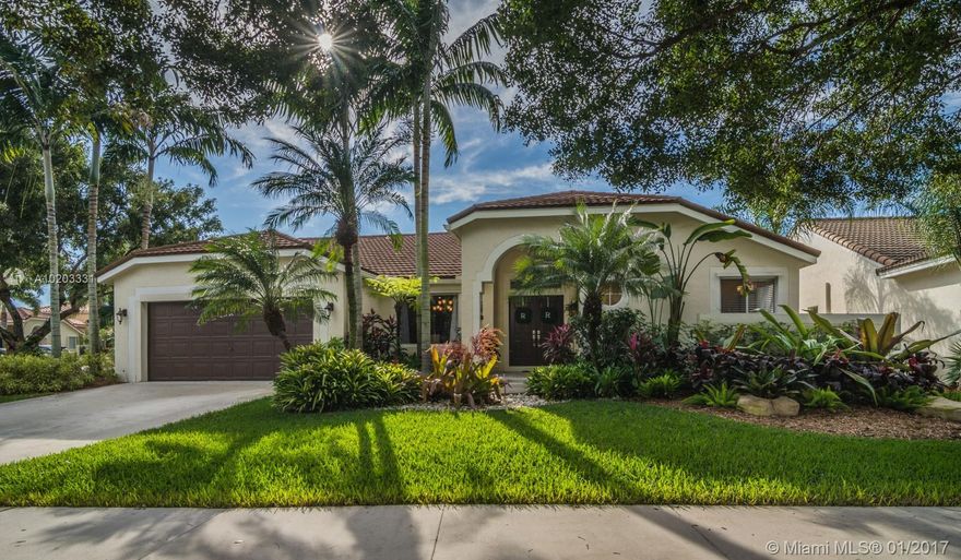 Turn key custom 1 story in sm gated Waterford Landings, across from Weston Town Center&Publix. Enjoy So Fla lifestyle in custom lagoon style saltwater pool w/sun-shelf/rock waterfall/new water heater.  Expansive natural stone patio w/lg overhang, fully fenced yard on oversized corner lushly landscaped lot. Designer gourmet kitchen w/ lg center island, Stainless & granite. Natural stone & hardwood Floors. Updated Baths w/marble floors/showers. DECRA Tile metal roof w/50 yr manuf. warranty, new Lennox A/C.