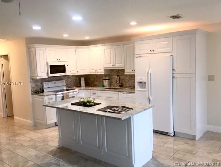 Completely remodeled and tastefully decorated townhouse in Lauderdale West. Lots of light and air in this TWO bath, ONE bed townhouse. Open style kitchen. New kitchen appliances. New bathrooms. New  high impact windows. Plenty of storage space. All tiles (no carpet). TWO assigned parking spaces next to the front door. Maintenance includes roof repair, basic Uverse by ATT, free shuttle to nearby Publix shopping plaza. TWO heated pools, tennis courts, club house. *More than $35,000 in upgrades*. New washer and dryer. Bedroom has direct access to renovated and enclosed Florida room. Close to I-595, Ft. Lauderdale airport, and very good  schools in Plantation. SEE PICTURES AND BROKER REMARKS.