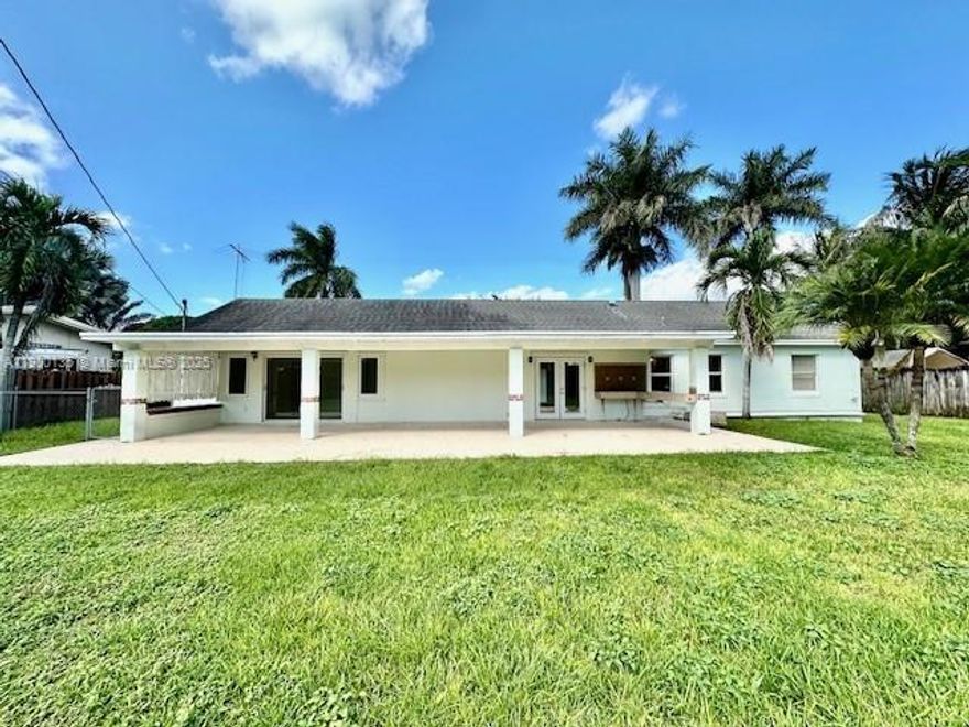 4-Bed, 3-Bath Home on Double Lot – No HOA! Beautifully renovated split-level home in Homestead on an oversized double lot. Features include custom all-wood kitchen and bathroom cabinets, porcelain tile throughout, and a spacious master suite with dual walk-in closets, Jacuzzi tub, and walk-in shower. Enjoy a large, covered patio with outdoor kitchen (gas cooktop + sink), perfect for entertaining. Major upgrades: New plumbing & electrical panel (2006) - New A/C (2023) - Full RV hookups (electric, water, sewer). Two wide side gates offer full backyard access with space to park RVs, boats, or trailers—plus room to add a pool. Located in a quiet, established neighborhood near great schools and shopping. No HOA restrictions!