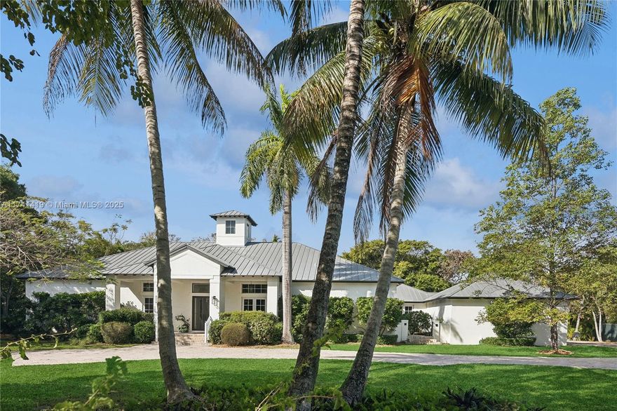 Beautiful sprawling Key West Style gated estate with light, bright, open interiors! Foyer leads to a formal living room with volume ceilings overlooking the gorgeous lushly landscaped yard. Fabulous gourmet kitchen with a breakfast room opens to an inviting family room with handsome built-ins. A split bedroom plan with 3 private ensuite bedrooms on one side. There is a luxurious primary suite with a sitting area, oversized closet, and expansive primary bath. 5th bedroom is being used as an office. Large patio and terrace area are perfect for entertaining. The freeform pool/spa is heated. There is a tennis court which can easily be converted to a pickleball court, impact windows and doors, metal roof, French doors, generator, EV charger and much more! This home defines a luxury lifestyle!