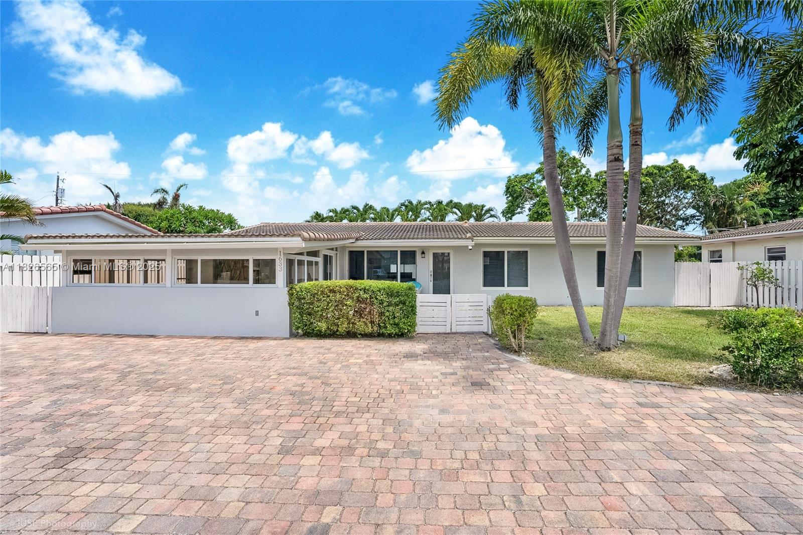 Be the first to live in this fully renovated 4-bedroom home in The Cove, just 1 mile from the sand and surf. No detail has been spared—enjoy a brand-new kitchen with quartz countertops and stainless steel appliances, modern bathrooms, and large rectified porcelain tile floors throughout. The home also features impact windows and doors, a new AC unit, and new Diamond Brite *heated* salt-water pool with an expansive marble paver deck. This is coastal living at its finest—move-in ready and close to shops, dining, and all the Deerfield Beach has to offer.