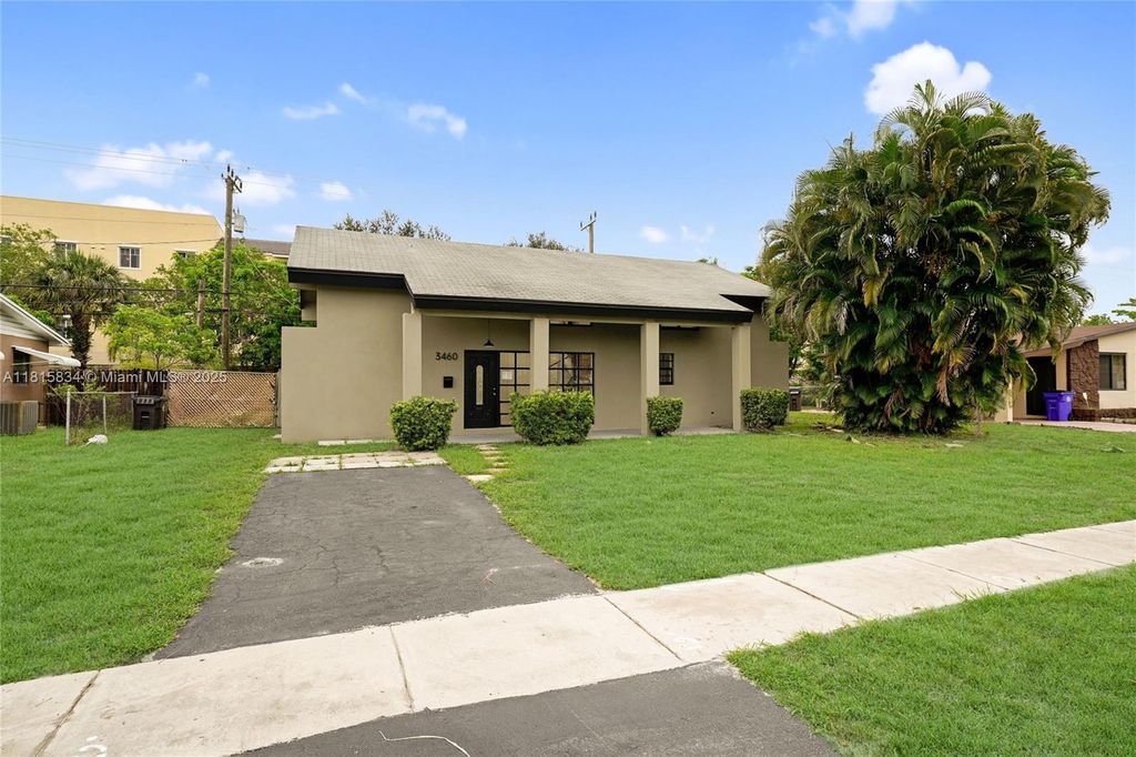 Photo of 3460 NW 43rd Ave, Lauderdale Lakes, FL 33319 (MLS # A11815834)