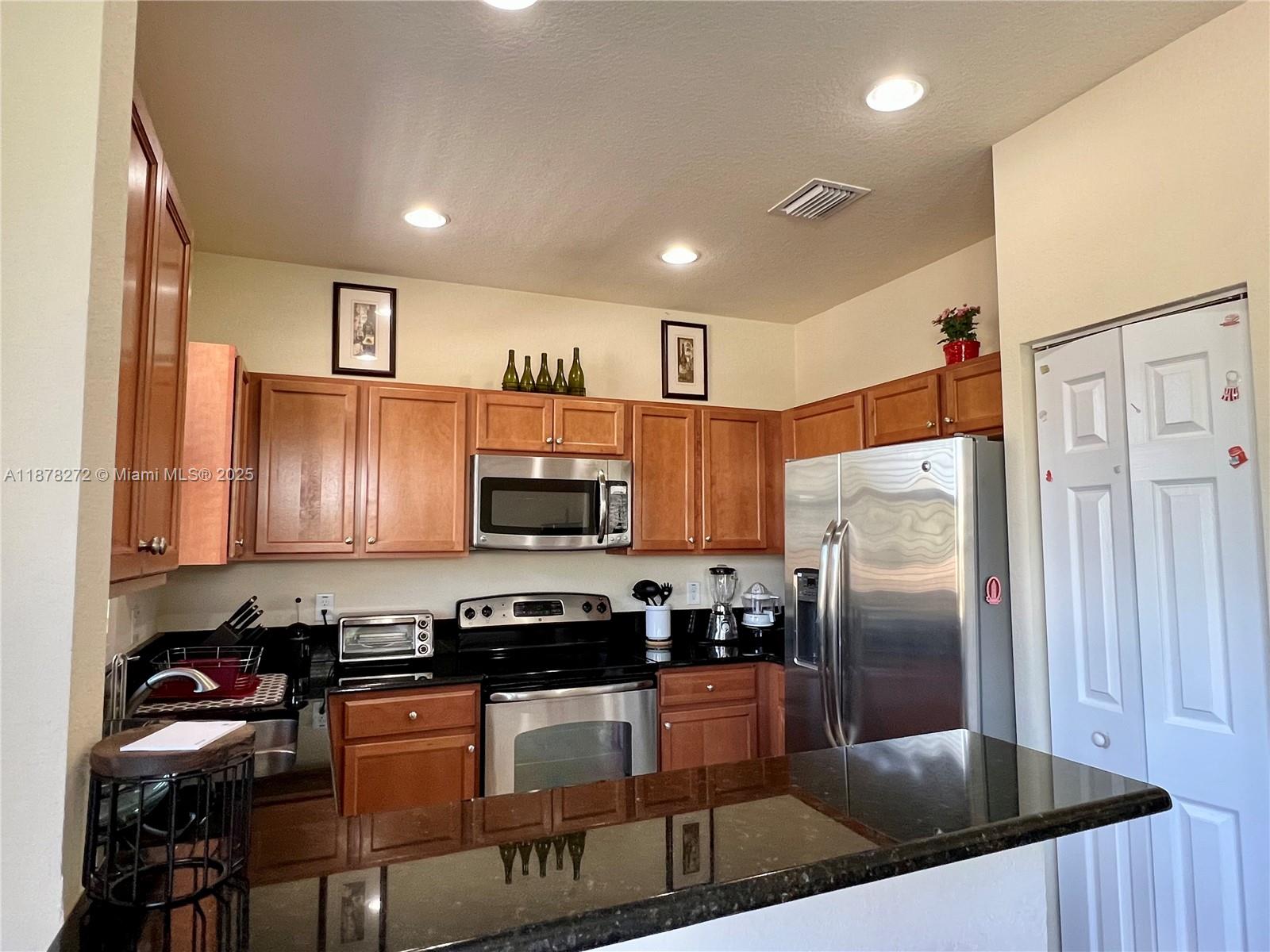 This townhouse is a beautifully furnished 3-bedroom, 2.5-bathroom home in Santorini at Islands at Doral. It boasts a prime location, just a short walk or bike ride to two brand-new public parks and top-rated A+ schools. The home is spacious yet easy to maintain, featuring a well-kept kitchen, formal dining area, and a paved backyard. All bedrooms are generously sized, with the master suite offering an expansive bedroom and bathroom. Additional features include a one-car covered garage plus two outdoor parking spaces. Residents also enjoy access to a stunning clubhouse with a variety of amenities.