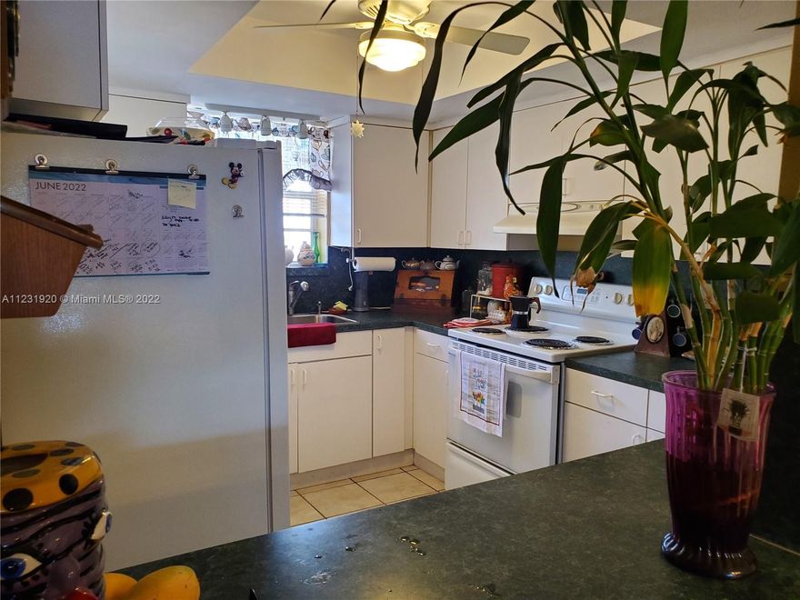 Spanish inspired Townhouse with deeded dock and ocean access, one fixed bridge with plenty of access. Located in Areta Estates in North Miami Beach. NO HOA! FEE SIMPLE! This townhouse features a Spanish style with terrazzo tile as you enter your front sitting patio, also featuring a fish pool. It is approximately 1450 sq ft featuring a back yard with Mango trees. It is 2 stories with open floor plan and features a balcony off the Master bedroom overlooking the canal. Relax and enjoy the backyard with an amazing and tranquil water view setting. Two full bedrooms upstairs with full bath and a powder room located on the main floor. Centrally located near Aventura, Bal Harbor, Miami Beach. If you are looking for a home to park your boat...This is it.. Needs a little TLC ...