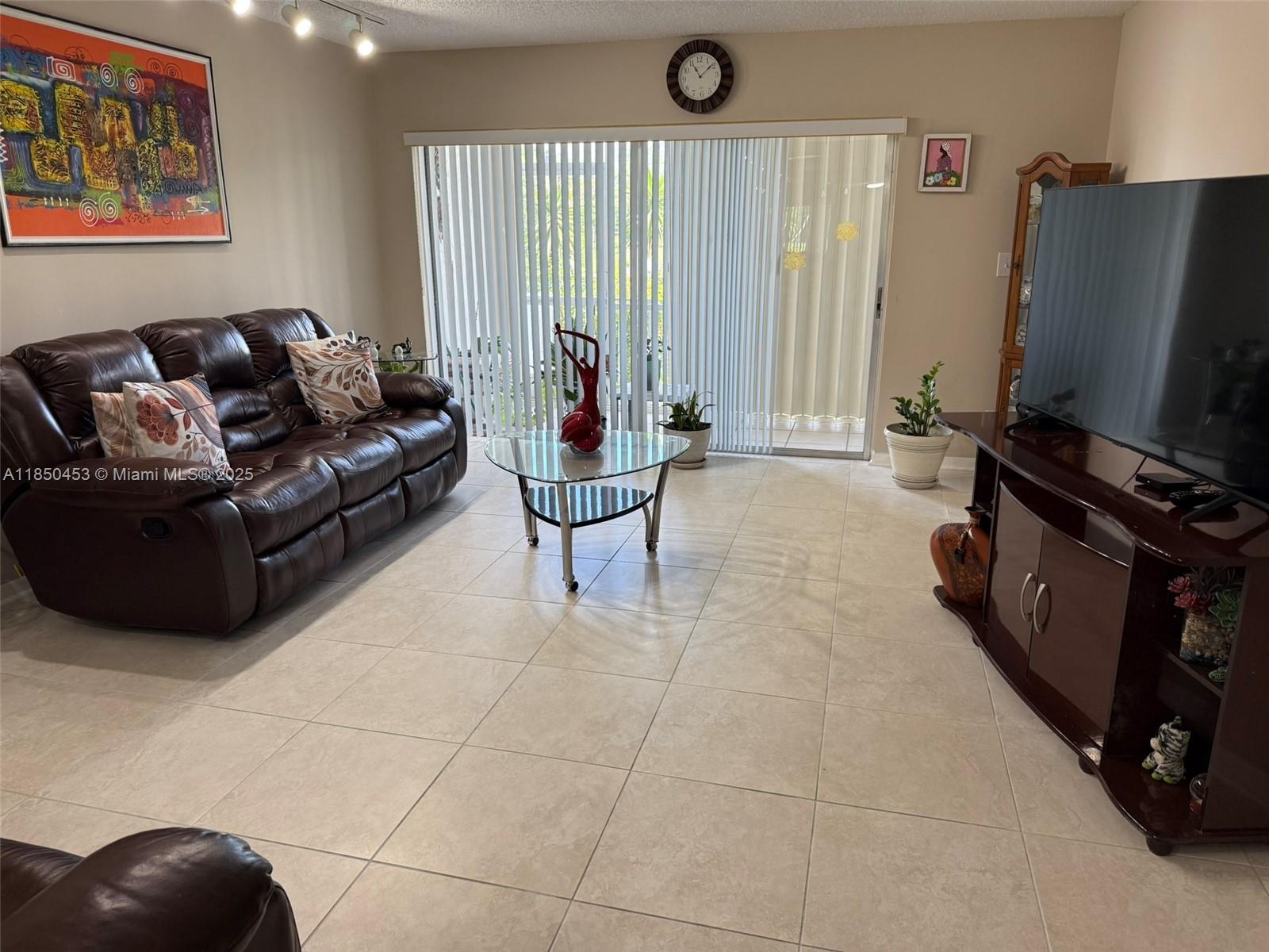 Welcome to this bright and spacious FIRST FLOOR 2-bedroom, 2-bathroom unit featuring large neutral tile throughout and three generous walk-in closets. Recent updates include a hot water heater (2021), electrical panel (2022), new washer and dryer, and AC condenser (2022) with AC unit from 2015. Enjoy added peace of mind with accordion shutters, main water shut-off valve, and a new building roof installed in December 2022. This is the only building in the community that allows in-unit washer and dryer. The community offers resort-style amenities including a clubhouse with gym, library, and second-floor party room, along with five pools and full-time security. Association dues cover landscaping, high-speed internet, water, garbage, and more. No pets allowed. 55+ community.