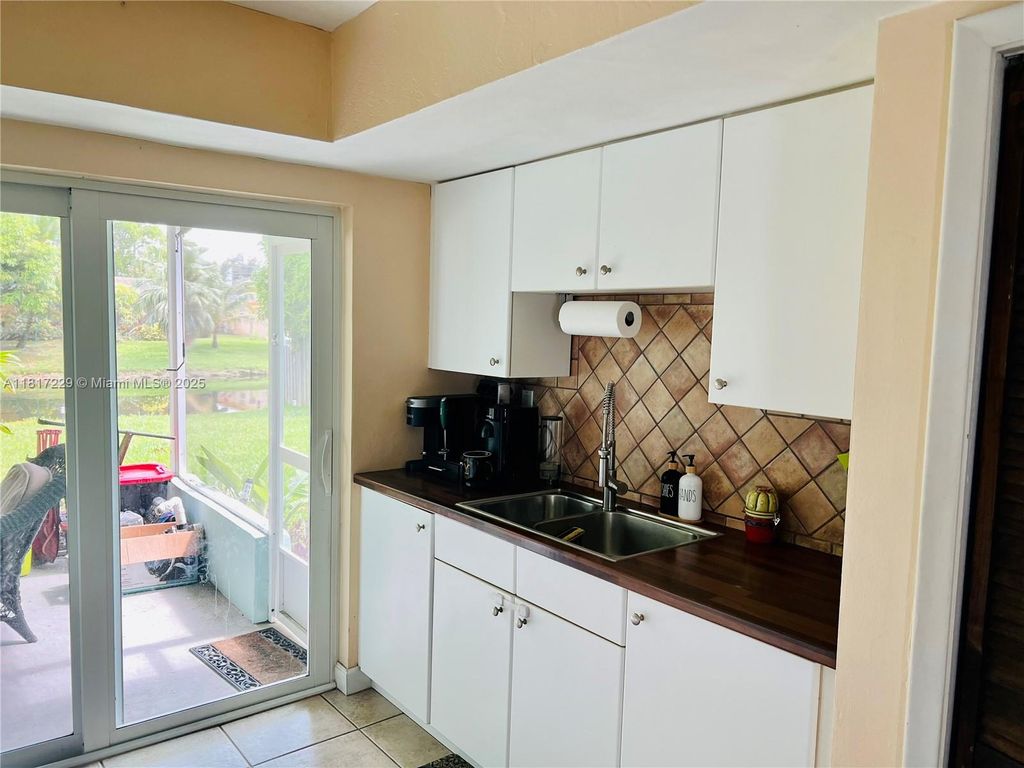 Photo of 8106 NW 21st Ct, Sunrise, FL 33322 (MLS # A11817229)