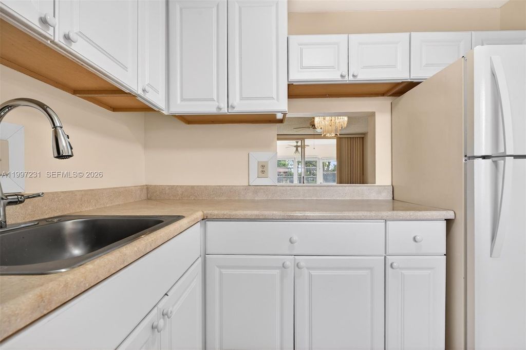 Photo of 5801 NW 62nd Ave #106, Tamarac, FL 33319 (MLS # A11997231)