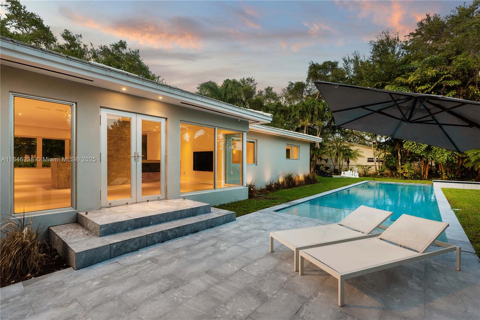 Beautifully updated & thoughtfully redesigned, this 3-bedroom, 2-bath home sits on a 14,000 sq ft corner lot in one of Coral Gables’ most desirable neighborhoods. Blending classic charm with modern sophistication, the home features refinished hardwood floors, a chef’s kitchen, designer European fixtures, and a bright, open-concept layout. Designed by a leading smart home, AV, and lighting specialist, it offers seamless integration of comfort, convenience, and security. Step outside to enjoy a stunning pool and hot tub, outdoor shower, and a lush, private yard ideal for entertaining. With impact windows and doors, European-style bathrooms, high-end finishes, and a two-car garage, this move-in-ready residence is the perfect blend of style and substance, smart, stylish, and built to impress.