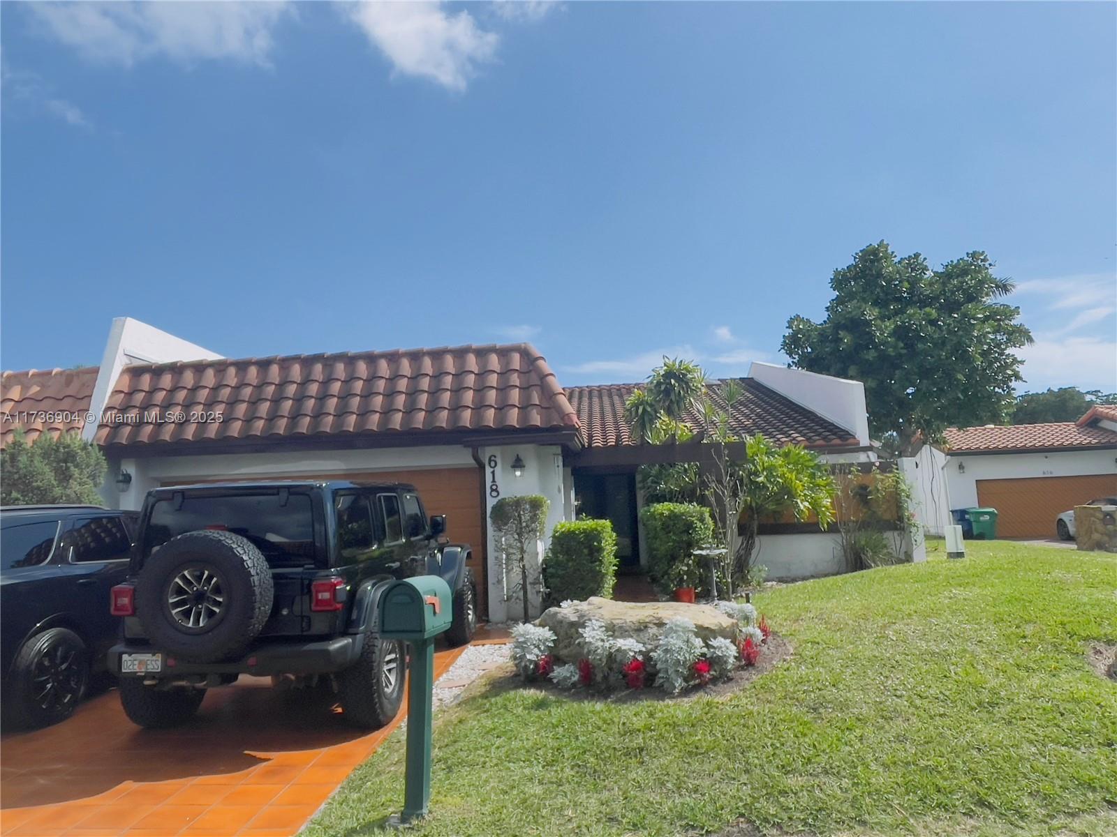 Remarkable villa located in a quiet gated and secured community. This home is near Aventura mall shopping and Hospital, amazing restaurants, I95, 441, Turnpike and Palmetto, also close to several school districts, and more. The house features 3 bed 2.5 bath, 2127 SQ FT Living area, the largest and open space living Room and Dining, bright and spacious with 3 patios, 1 large area for seating and BBQ in the back of the house and a small area patio in living rm area.
It comes with 2 car garage. Kitchen is updated with stainless steel appliances, Tile and wood floors throughout. Low HOA fee that includes internet and basic cable. This is a great starter home for a family or for investment, no rental restrictions. See broker remarks for more info.