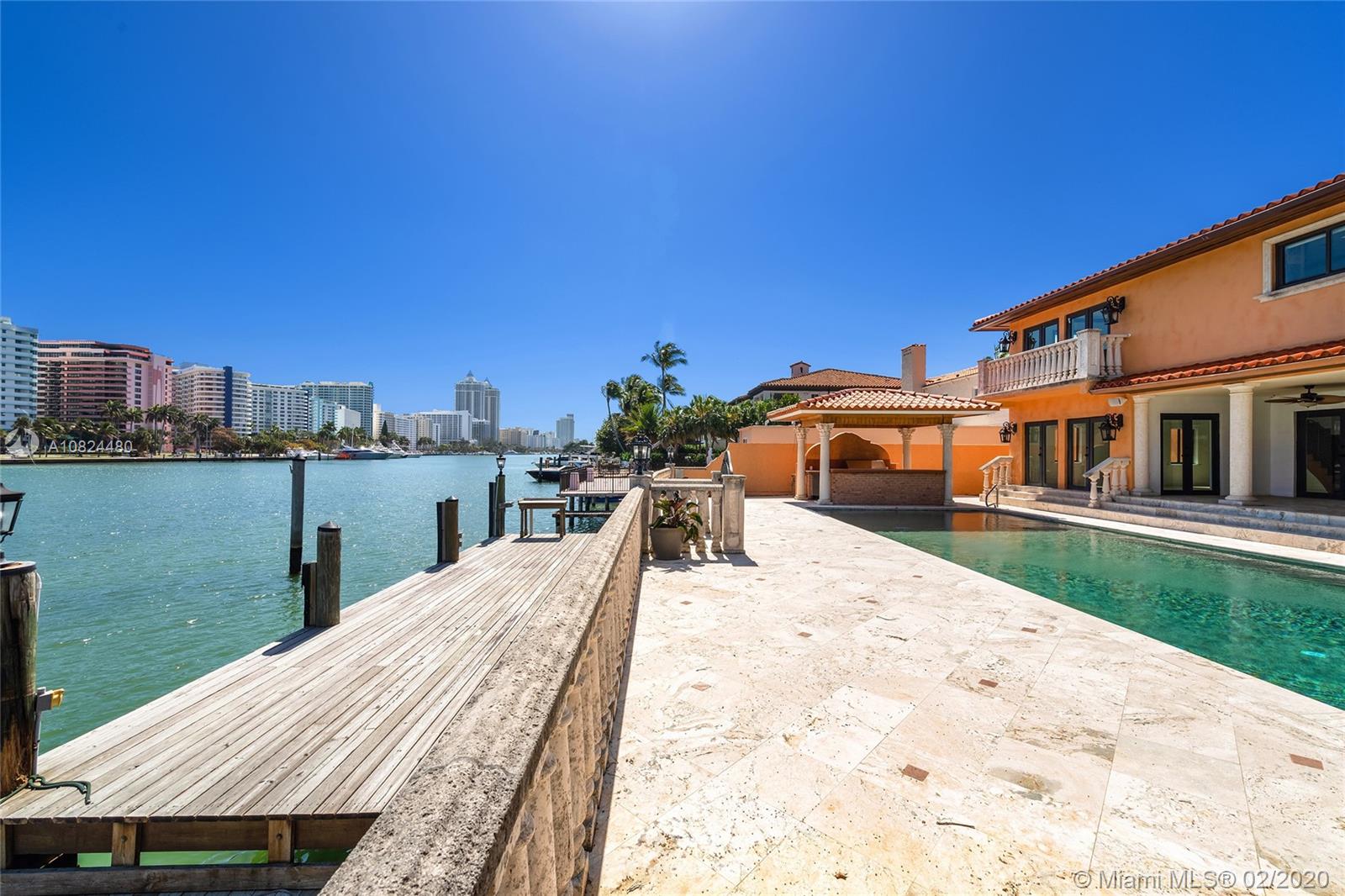 This 2-story Mediterranean waterfront home on exclusive Pinetree Drive is a must see. The 4BR/5+1BA home features fine marble floors, and sits on lush 11,954 SF lot w/4,443 ADJSF of interior space. An open foyer greets w/ circular rotunda ceiling, large living room space with a fireplace & spacious private dining & family/media rooms each w/direct access to the large pool deck. The open kitchen sports a granite center island, counter tops/backsplash, top-of-the-line appliances & private breakfast area. The 2nd floor principal suite has a balcony that overlooking the pool & Intracoastal Waterway, large bathroom w/sunken spa tub and steam shower.