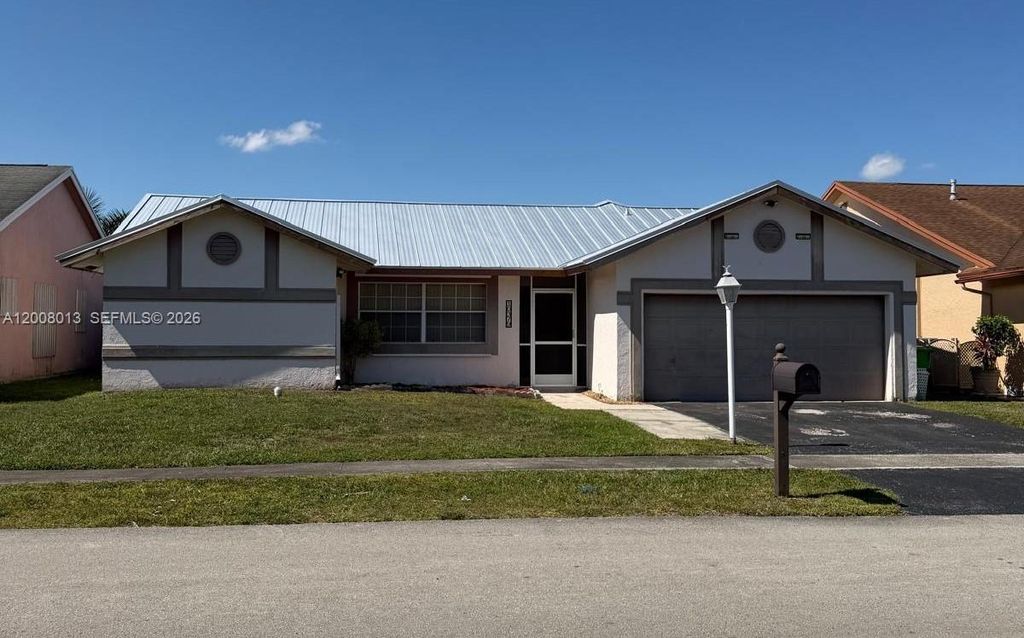 Photo of 10379 Welleby Isles Blvd, Sunrise, FL 33351 (MLS # A12008013)