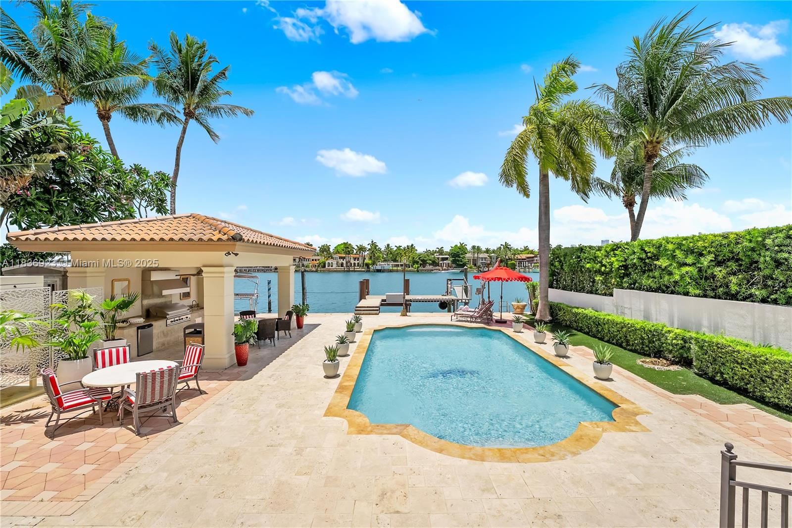 Nestled on prestigious Hibiscus Island, this 6 beds 5 baths Mediterranean waterfront home captures timeless elegance fused with resort-style living. Step through the grand entryway into soaring high ceilings, a sweeping staircase, exceptional views of the water and your private oasis. Architectural details exude charm of a European seaside villa with arched and stone accents and spacious layout designed for entertaining and comfort. Features include a chef’s kitchen, grand primary suite with 2 balconies, elevator, summer kitchen and lush landscaping for privacy. Perfectly positioned to capture expansive views of Star Island, Biscayne Bay and Miami skyline, the home sits on 60 feet of prime waterfront and includes a private dock.