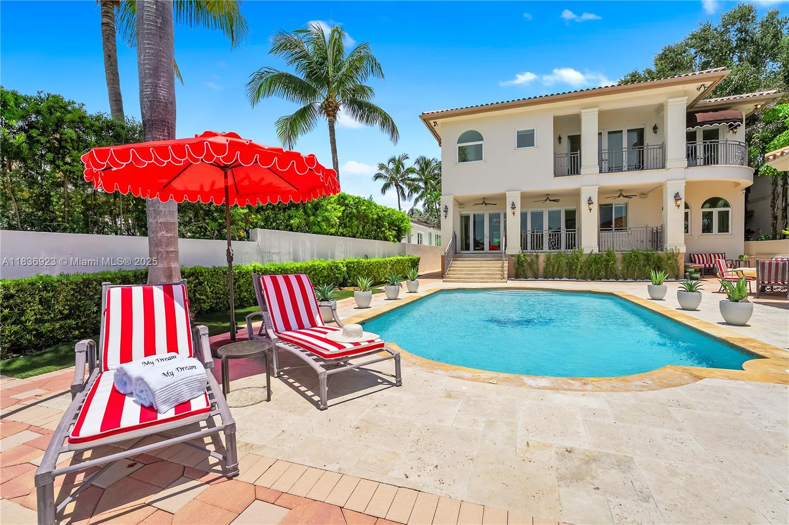 Nestled on prestigious Hibiscus Island, this 6 beds 5 baths Mediterranean waterfront home captures timeless elegance fused with resort-style living. Step through the grand entryway into soaring high ceilings, a sweeping staircase, exceptional views of the water and your private oasis. Architectural details exude charm of a European seaside villa with arched and stone accents and spacious layout designed for entertaining and comfort. Features include a chef’s kitchen, grand primary suite with 2 balconies, elevator, summer kitchen and lush landscaping for privacy. Perfectly positioned to capture expansive views of Star Island, Biscayne Bay and Miami skyline, the home sits on 60 feet of prime waterfront and includes a private dock.