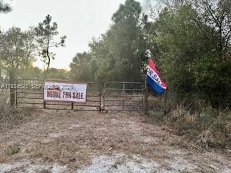 Build your dream in the desirable Montura Ranch community with no HOA, surrounded by established homes. Just minutes from Lake Okeechobee and Clewiston–Airglades Airport, this 1.25-acre lot offers serene seclusion on a quiet dirt road—mostly cleared with mature trees and privately fenced. Ideal for a custom home, mobile home, or weekend getaway. Flexible use allows for farm animals, hobby farming, or peaceful country living. Enjoy wide-open spaces and a relaxed rural lifestyle, just 90 miles from Miami.
