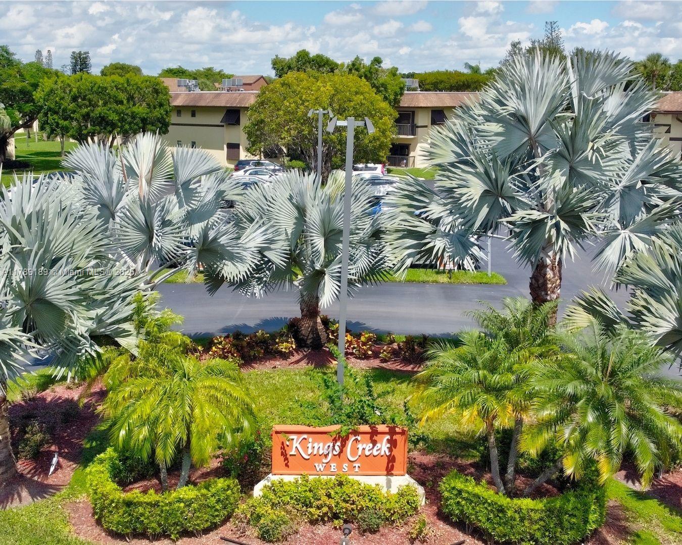 Spacious 2/2 updated unit in the beautiful Kings Creek West Community. This most desirable location is within walking distance to public transportation, shops, restaurants yet, it provides a safe, quiet and enjoyable residential environment. The unit is in move-in condition. The kitchen has white contemporary cabinets and is fully equipped with refrigerator (2024), dishwasher, range, microwave and in-unit washer and dryer (2023). Both bathrooms are also tastefully updated. There is ample closet space and storage. Sliding glass doors in the living room lead to an open balcony overlooking the well maintained green areas. Hurricane shutters are included. New AC in 2021. Relax and enjoy our beautiful South Florida days by the pool, tennis courts and recreation facilities.