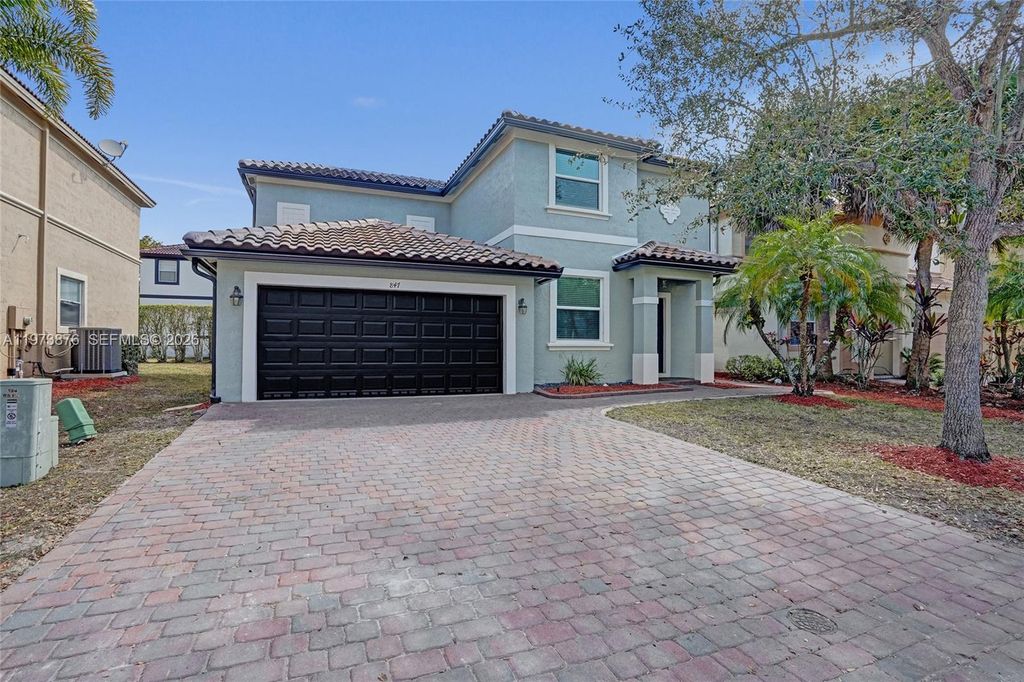 Photo of 847 NW 127th Ave, Coral Springs, FL 33071 (MLS # A11973876)