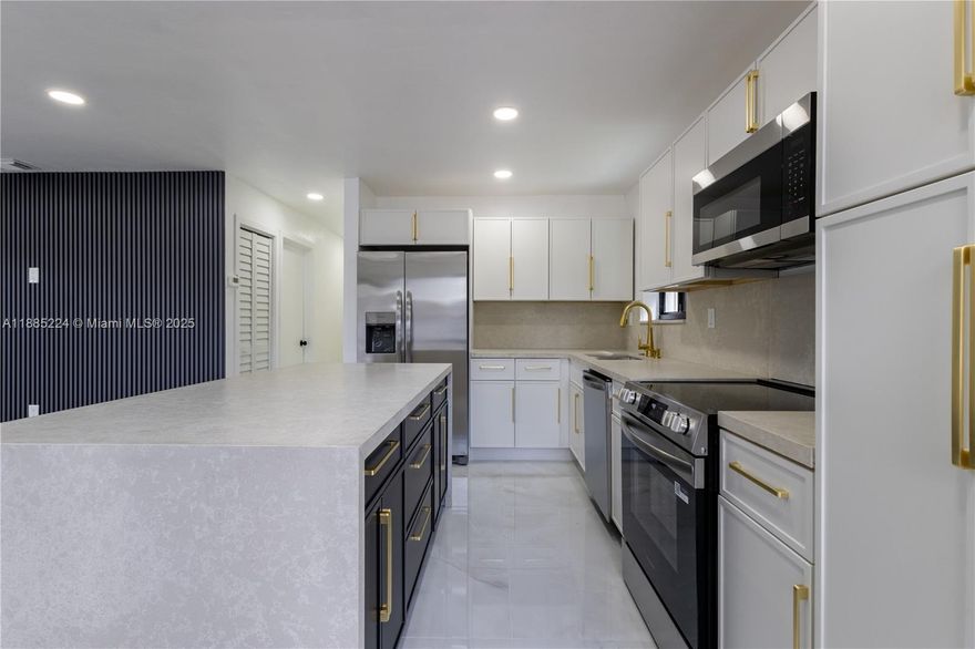 Beautifully renovated 3-bedroom, 2-full bath residence in Miami, featuring a brand new roof (2025), new central A/C, hurricane impact windows and doors, and a designer kitchen with Taj Mahal quartz waterfall island, Italian cabinetry, and new stainless steel appliances. Spacious interiors include porcelain marble flooring throughout, recessed lighting, and custom designer wood panel accents. Bathrooms are finished floor-to-ceiling in porcelain with frameless glass doors, modern vanities, and mirrors. Additional upgrades include a tankless water heater, freshly painted interior/exterior, Dura fence with gated entry, and new professional landscaping. Conveniently located near schools, hospitals, I-95, Wynwood, and more. Turnkey and move-in ready.