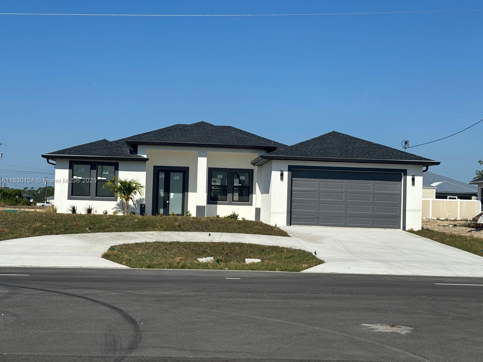 Brand new 4-bedroom, 2-bathroom residence, built in 2025, nestled in an amazing neighborhood of North Cape Coral. This contemporary gem offers everything you need for comfortable living, featuring a spacious two-car garage and modern open concept design throughout. The well-designed kitchen boasts modern appliances, ample cabinetry, and a convenient breakfast bar that flows into the living and dining areas—perfect for gatherings and entertaining. The master suite is a true retreat, complete with an en-suite bathroom designed for relaxation. Three additional bedrooms provide versatile space for family, guests, or a home office. Enjoy the expansive 10,000 sq ft backyard, ideal for outdoor activities. Call today!