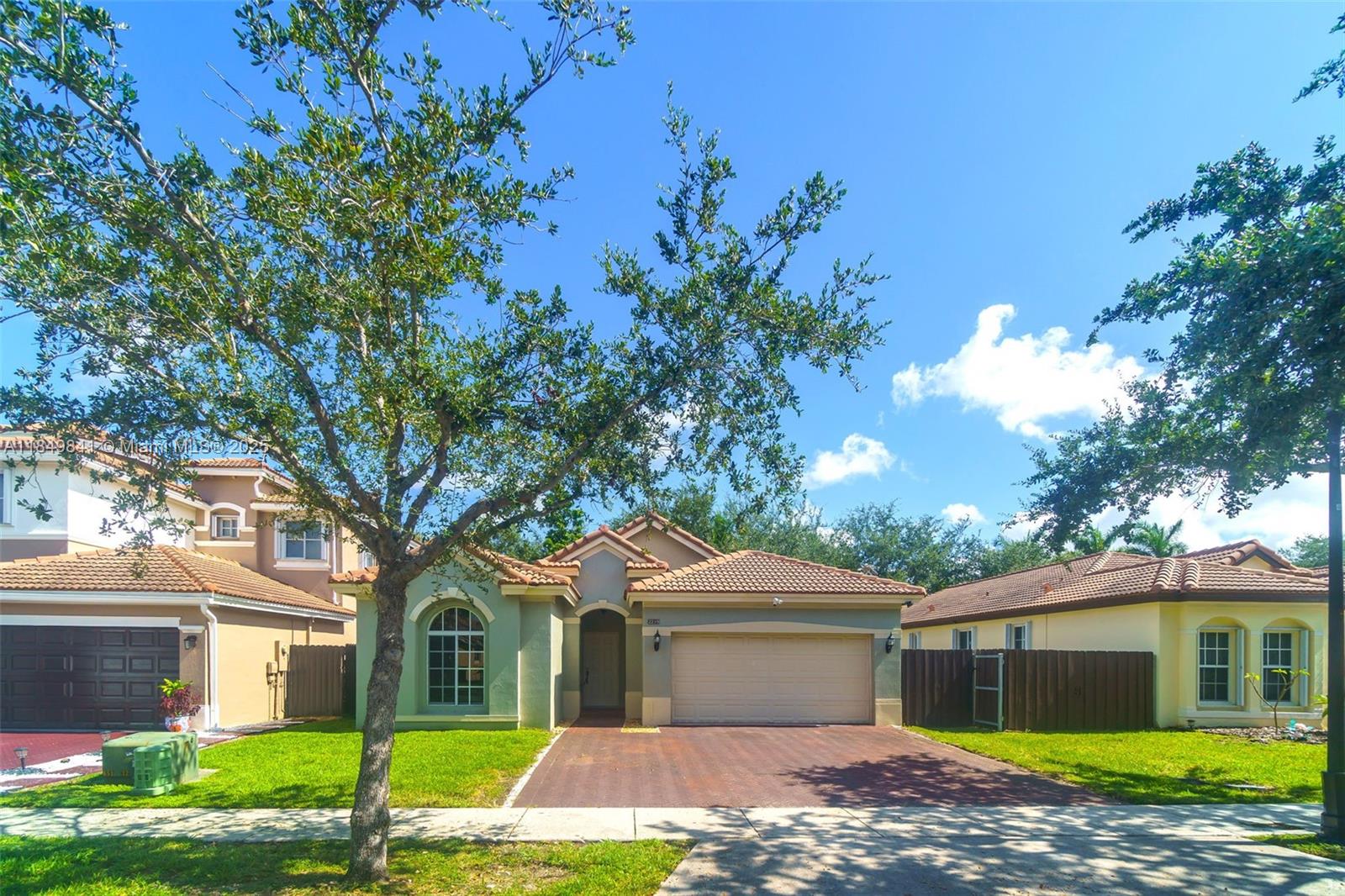 Beautifully maintained 3BD/2BA home located in the sought-after gated community of Ventanas del Sol. This spacious layout features high vaulted ceilings, a granite kitchen with breakfast area, tile floors throughout, and a split-bedroom design for added privacy. The large primary suite includes a walk-in closet, soaking tub, and double vanity. Enjoy a fenced backyard perfect for entertaining or relaxing, plus a 2-car garage. Low HOA. Centrally located near A-rated schools, Turnpike access, Homestead Baptist Hospital, shopping plazas, and just minutes from the Florida Keys and Everglades National Park. Ideal for families or investors looking for a move-in ready property in a high-growth area.