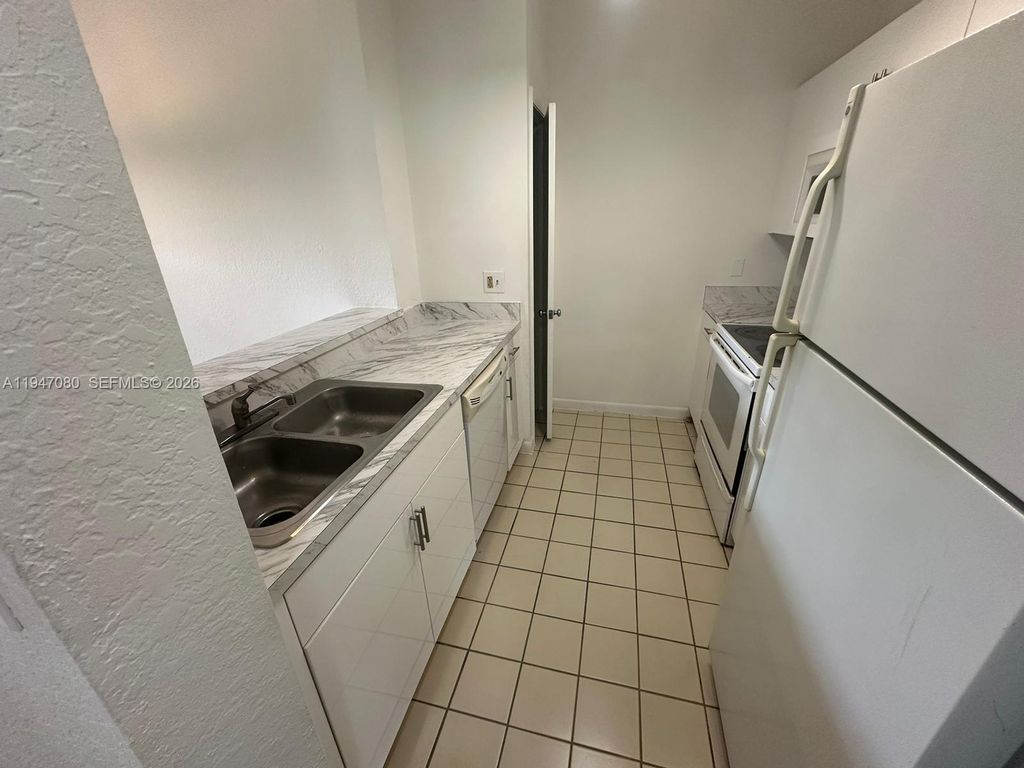 Photo of 2881 N Oakland Forest Dr #202, Oakland Park, FL 33309 (MLS # A11947080)