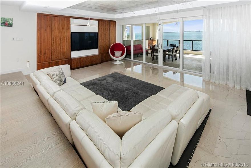 Boat Slip included!  This expansive 4,453 sq/ft waterfront home was meticulously constructed, featuring a flow-through layout with a grand living/dining rm, chef kitchen, family room and spacious master suite – all with direct water views.  The home offers 5 bdrms, 4.5 baths, den (flex 6th bedrm), maids rm/office, laundry rm, two covered terraces, infinity edge Jacuzzi and a summer kitchen.   Boat slip in the building private marina accommodates up to a 55 foot vessel.