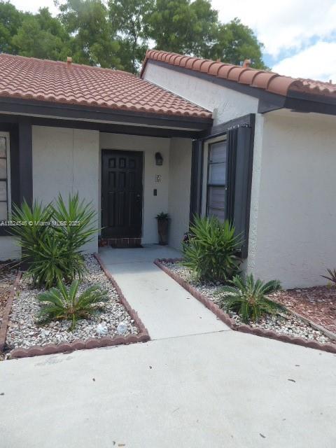 Rare opportunity for a one story village home in Lakes of the Meadow. 1/1 with tile floors, rear fenced patios, lake front and open green space at rear. Private assigned parking space with plenty of guest parking available. Patrolled security. Excellent location. Enjoy all the amenities: clubhouse, pool, tennis courts, gym.