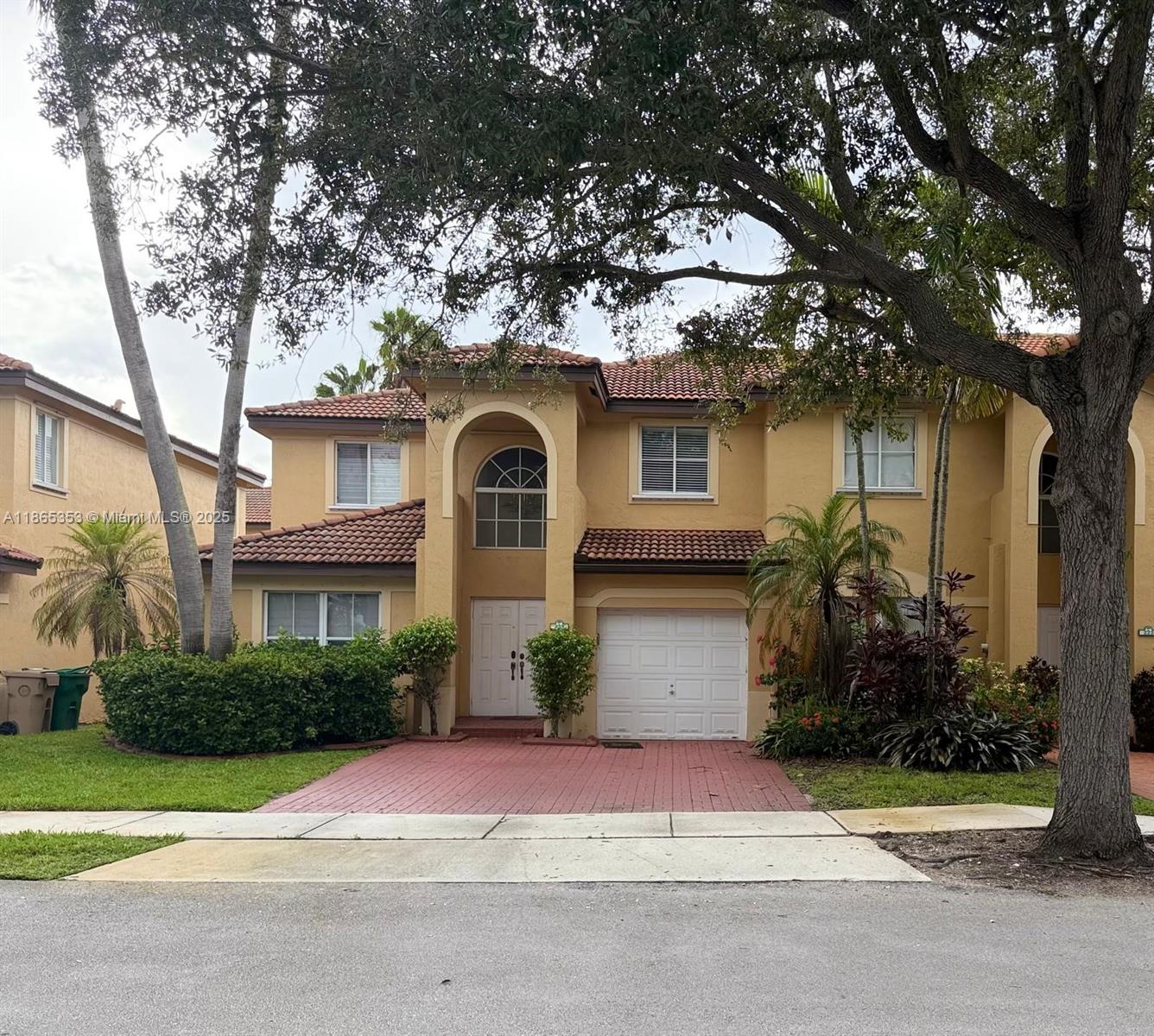 Beautifully updated 3-bedroom, 2.5-bath residence with abundant natural light and spacious living areas in a desirable gated community. This move-in-ready home features marble floors on the main level, remodeled kitchen, real wood stairs with designer tile accents, and wood floors upstairs. The primary suite has remodeled bath and closet, while the fenced patio with pavers and grassy areas is ideal for pets and gatherings. Parking is across the street, with the community pool and playground. 24-hour guard-gated surveillance. Ideally located near Weston with easy access to Ft. Lauderdale, Boca Raton, Miami, and the beach—this rare opportunity offers a remodeled townhome lifestyle.