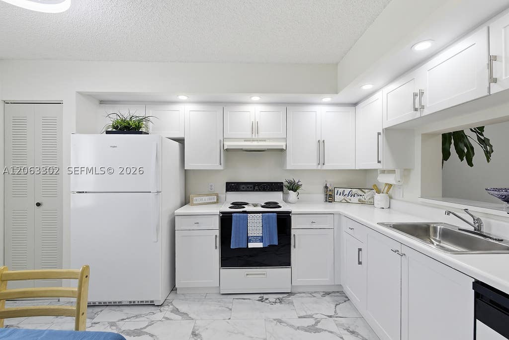 Photo of 1200 SW 137th Ave #308E, Pembroke Pines, FL 33027 (MLS # A12063302)